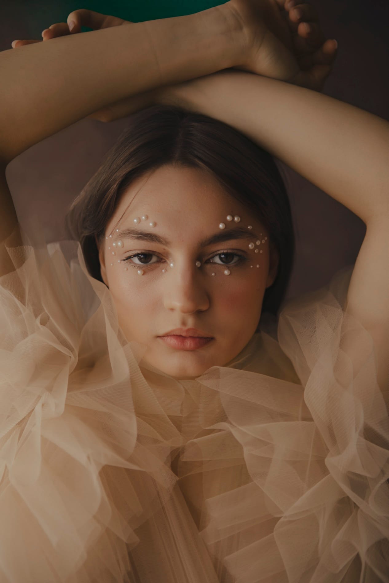 Woman in pearls at Body & Soul Studios, a luxury women's portrait studio in London.